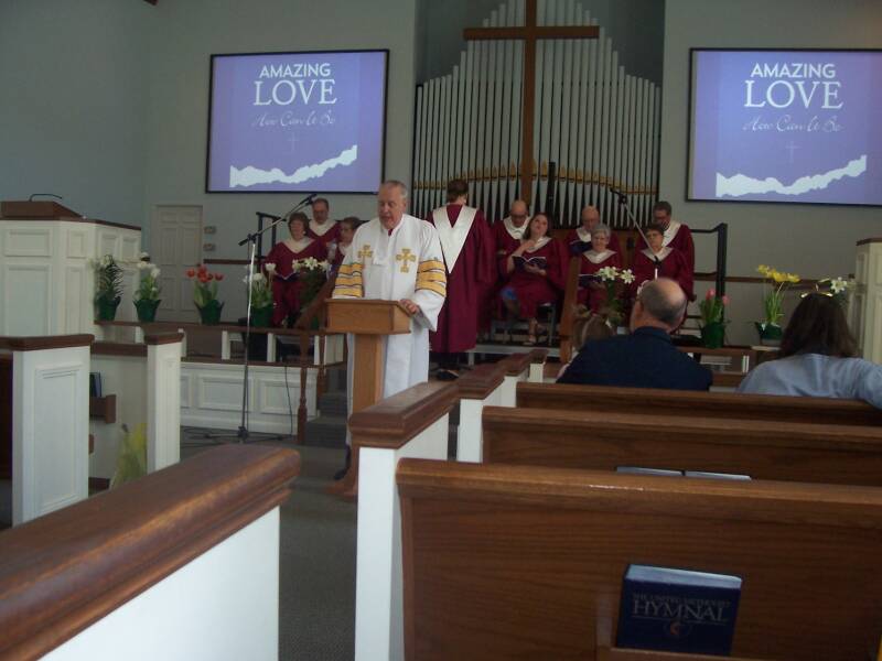 The pastor and the choir at the Easter worship service at the Paoli United Methodist Church